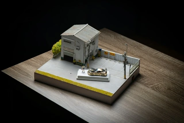 Architectural scale model of a modern house on a minimalist display base