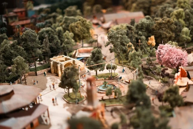Miniature park square with winding paths, trees, and landscaped gardens