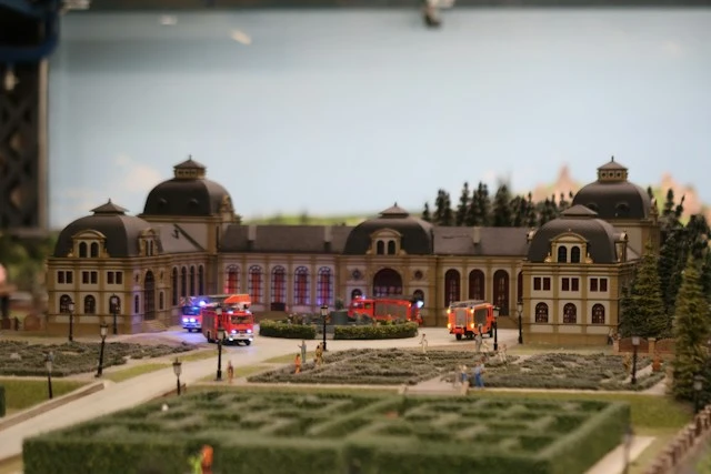 Detailed miniature town square with historic architecture and landscaped surroundings