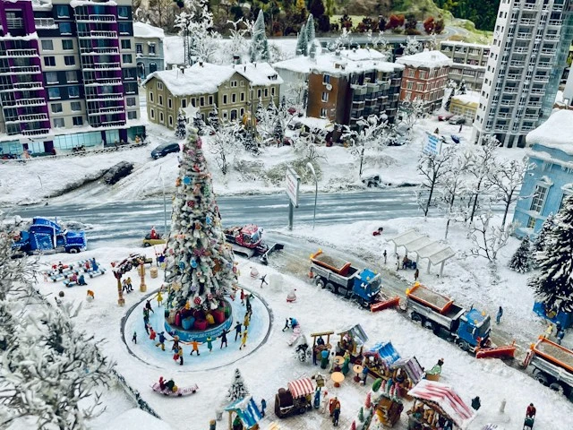 Miniature winter town covered in snow with small buildings and snowy streets
